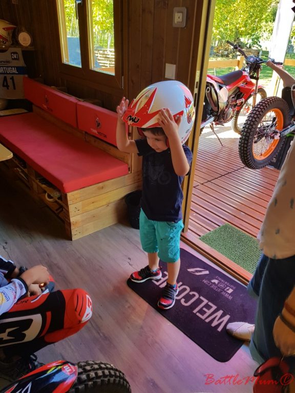 BattleKid trying on a helmet for size.