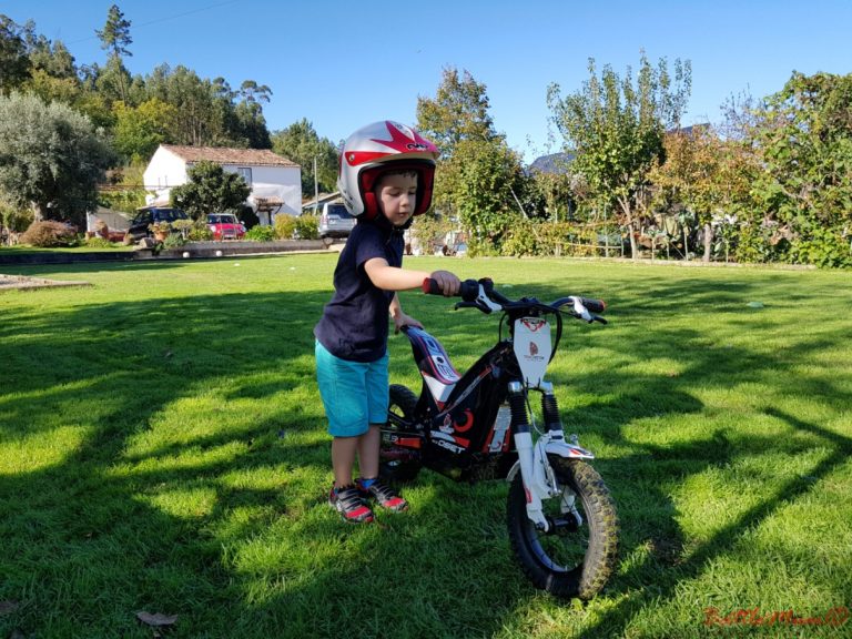 BattleKid proud as punch beside an Oset 12.5 motorbike