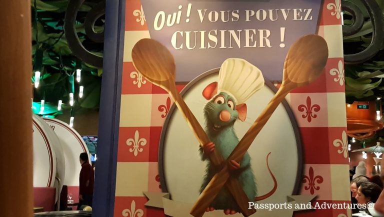 A poster from Bistro Chez Remy featuring the rat star of the film - One of the best restaurants in Disneyland Paris