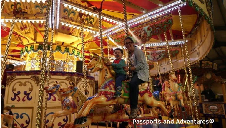 Mum and her son on a carousel at Folly Farm Adventure Park and Zoo