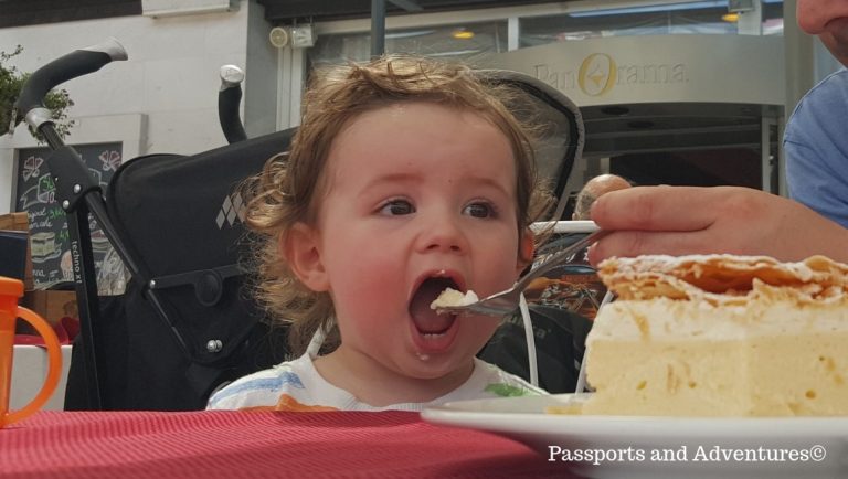 A toddler about to eat a forkful of Bled Cream Cake