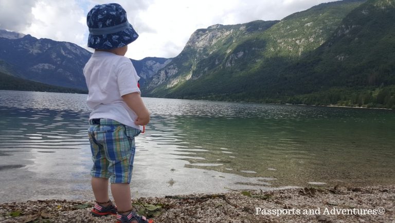 A toddler looking out across Lake Bohinj in Slovenia
