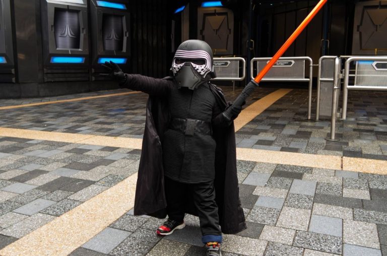 A young kid dressed as Kylo Ren from Star Wars in Disneyland Paris