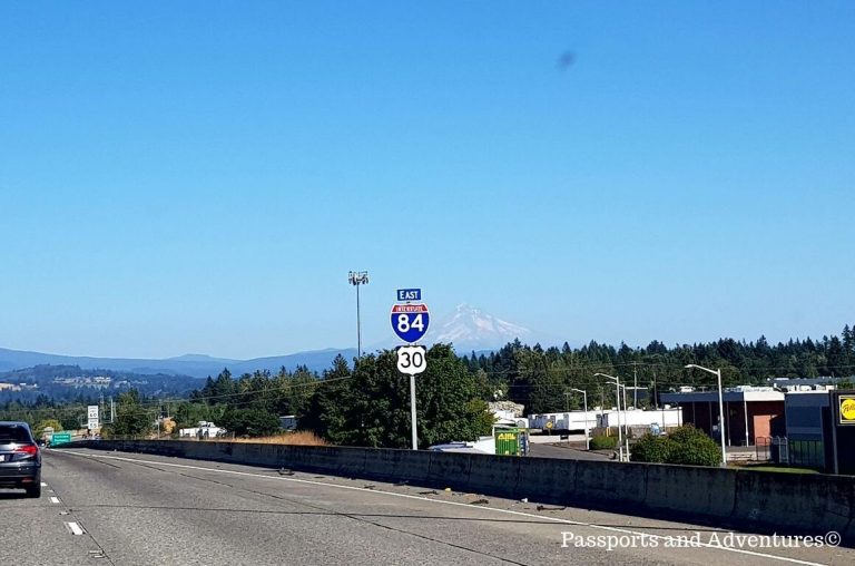 A sign of Interstate 84 with snowcapped Mount Hood in the background in Oregon, USA