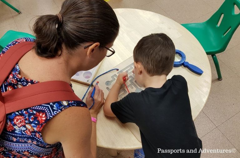 A mum and her son playing with a puzzle in OMSI, Portland